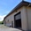 garage door and front of residential horse arena