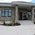 front door and decorative rock siding of custom home