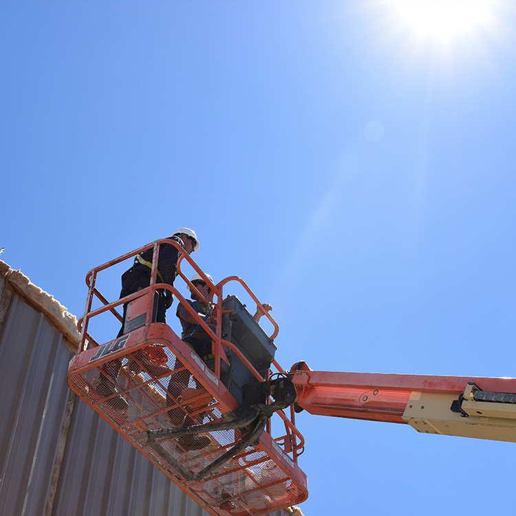 Center Point employees on boom lift working on commercial project in Ogden, Utah