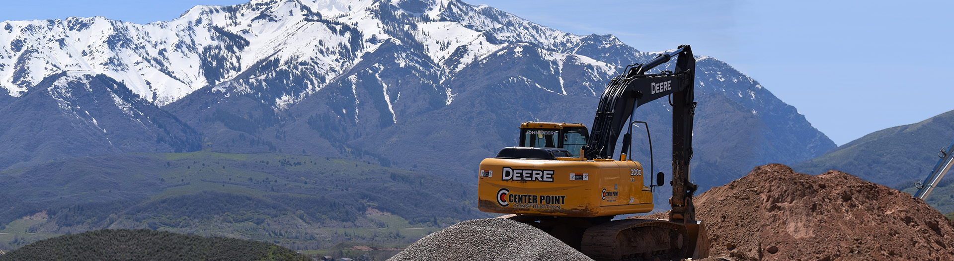 Center Point Construction trackhoe working in the mountains in Northern Utah