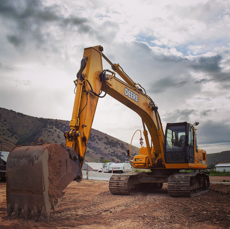 Parked Center Point trackhoe driven by excavation crews in northern Utah