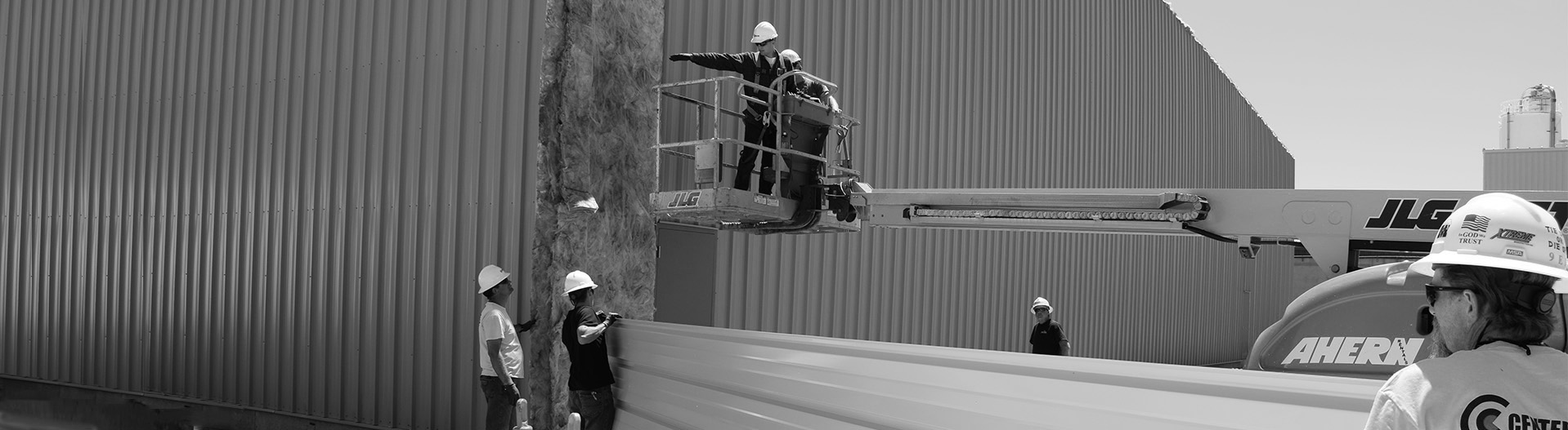 Center Point employees working on commercial steel building exterior in Ogden, Utah